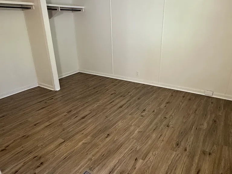 Master bedroom with two closet areas.