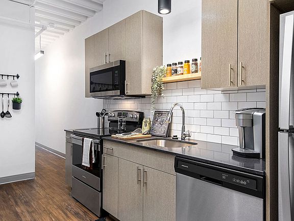 Our pet-friendly 1- and 2-bedroom industrial inspired lofts feature 9-foot, 4-inch ceilings with exposed structure and ductwork. Kitchens feature stone countertops and stainless steel appliances.