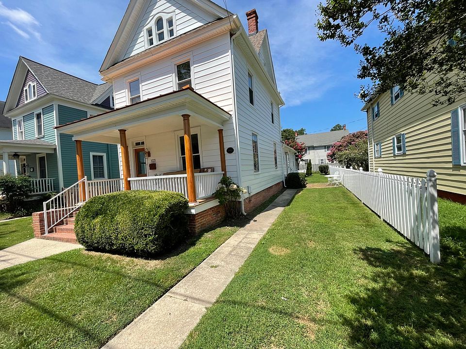 Lovely home with front porch and side yard.