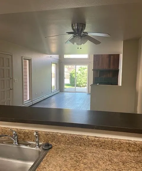 Living room and front porch view from Kitchen