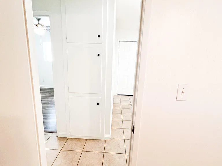 Hallway with storage/linen closet