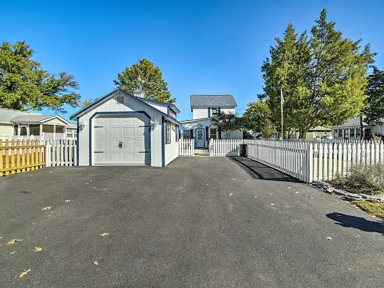 Driveway showing space for parking for up to 3 vehicles.