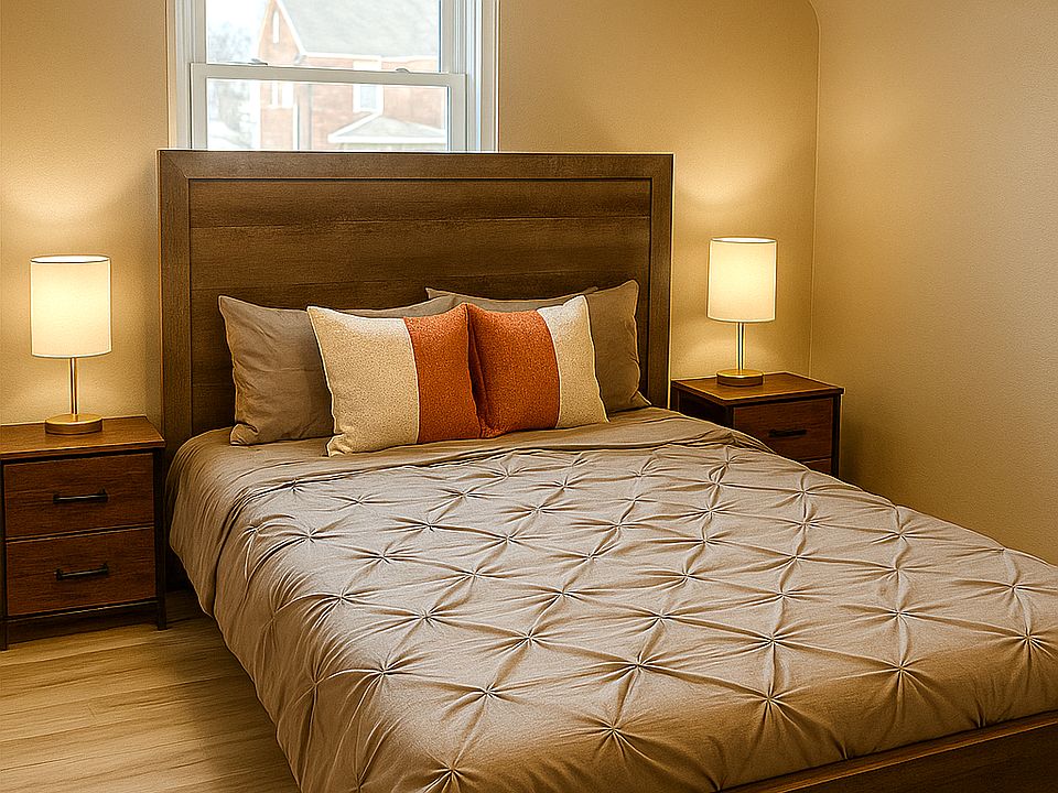 Queen size Bed with Roku TV inside the room