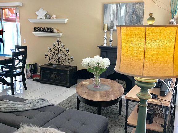 Living room  partial view of dining room and exit to patio