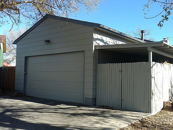 Heated garage w/carport