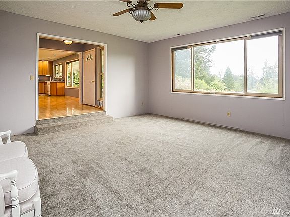 Living room, looking to front door and kitchen