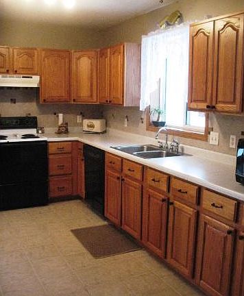 Large kitchen, Beautiful tile back splash and flooring. Lots of cabinets and counter space.