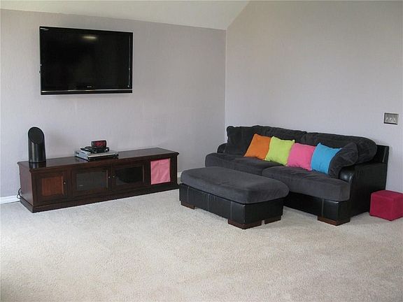 The living room offers multiple ways to arrange furniture.