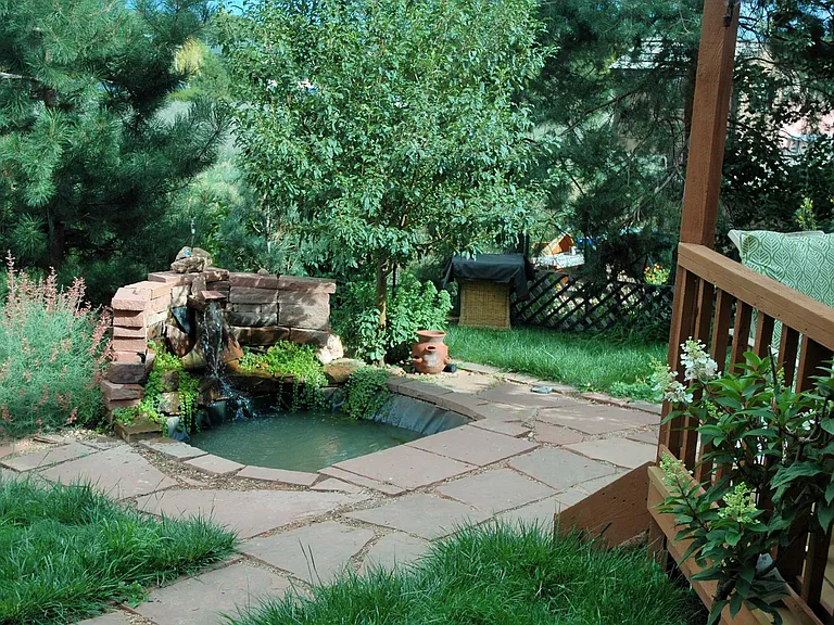 Pond wit waterfall provides a pleasant, calming atmosphere