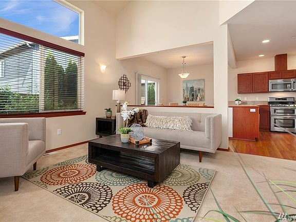Open concept floor plan with vaulted ceiling.