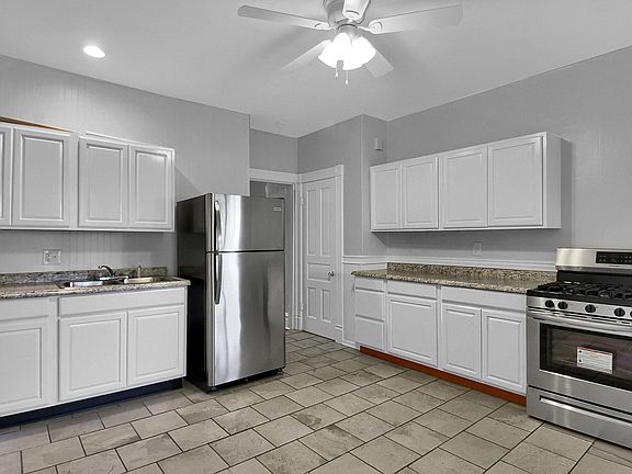 The Kitchen - ample cabinetry and countertop space, stainless steel appliances, ceiling fan