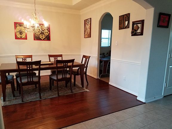 Formal dining room connected to kitchen through study nook
