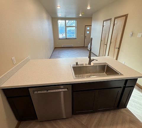Kitchen Island, with the dishwasher, facing the living room.