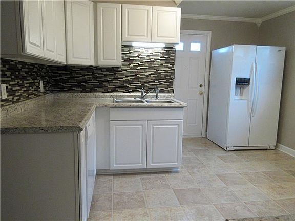 From the kitchen, walk out onto the 6x5 ft. side landing to enjoy the outdoors.