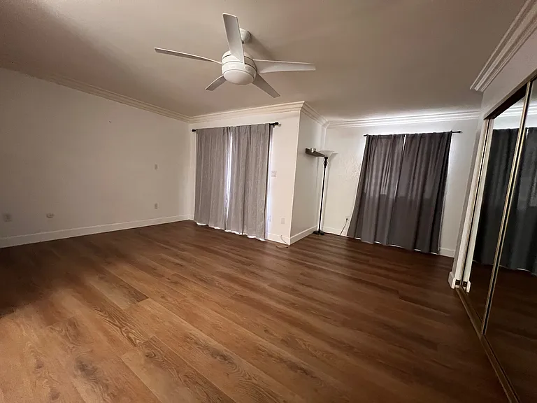 Master bedroom with mirrored closets