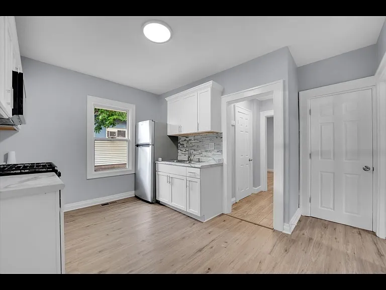 Kitchen New appliances cabinets, and floor