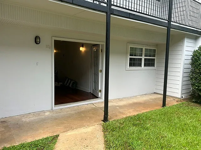 Unit and patio looking in from courtyard.