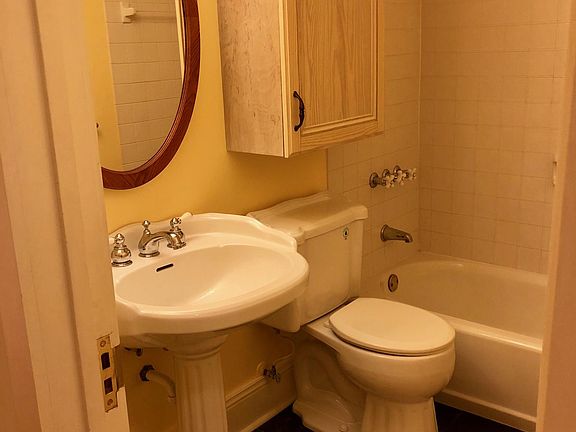 Mirror is a medicine cabinet and cabinet matches the kitchen