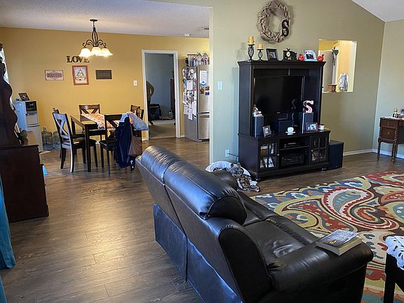 Living room to dining room, master bedroom door by fridge