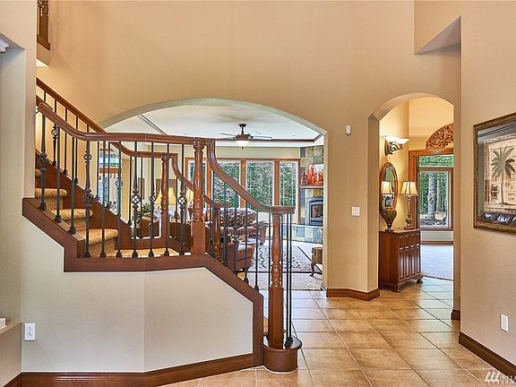 The entrance opens up to a magnificent display of detail and quality expected in this exquisite home.