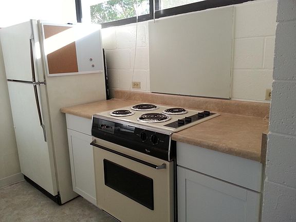 Kitchen with stove and refrigerator