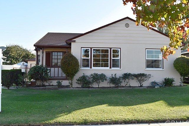 South view of 140 W. 123rd St. New exterior paint, newer custom window in living room & front bedroom, Well maintained, landscaped yard.