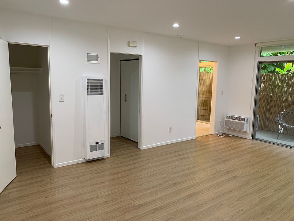 Main Room facing walk in closet, hallway and kitchen
