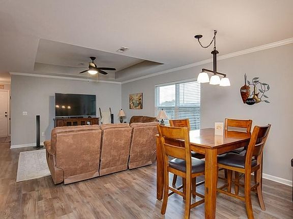 Perfect area for dining and entertaining with ceiling fan and dimmable lighting.