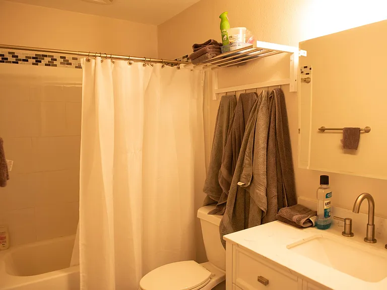 bathroom with tiled shower surround new vanity and great oversized medicine cabinet