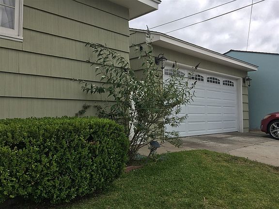 Detached 2 car garage with folding garage door and automatic opener