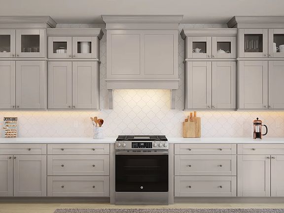 Kitchen with stainless steel appliances and glass upper cabinets