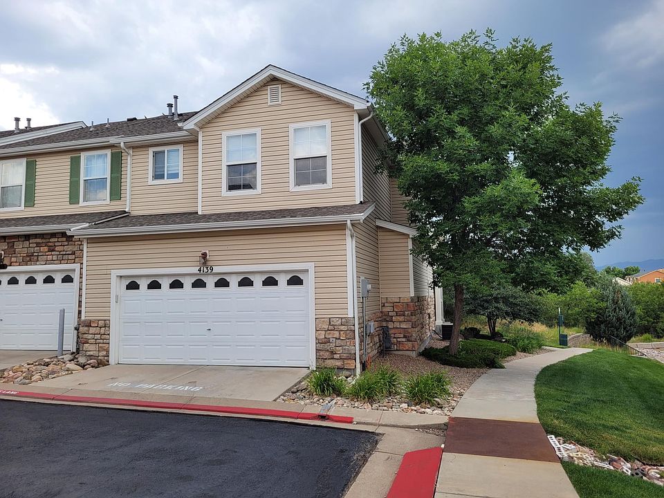 End unit with attached 2 car garage