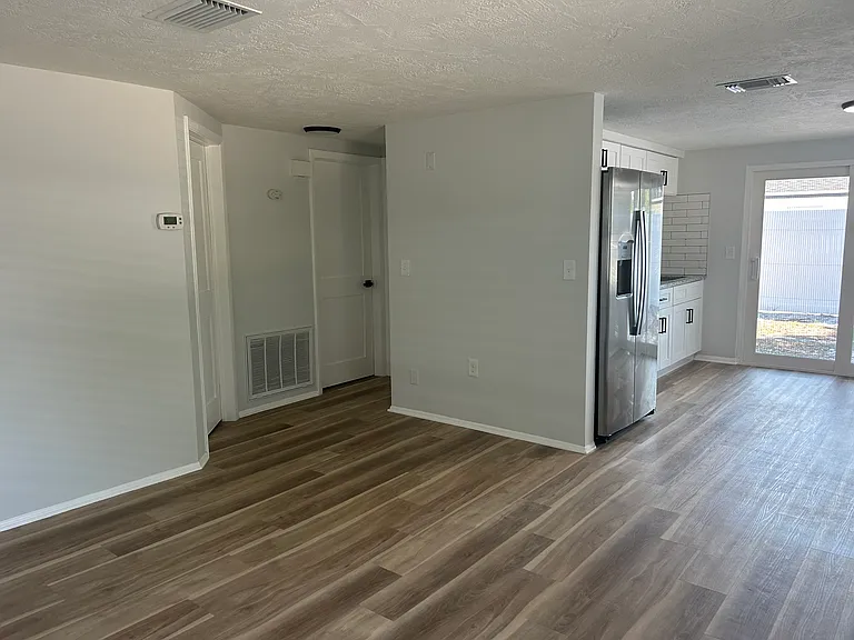 Living room is open to kitchen.