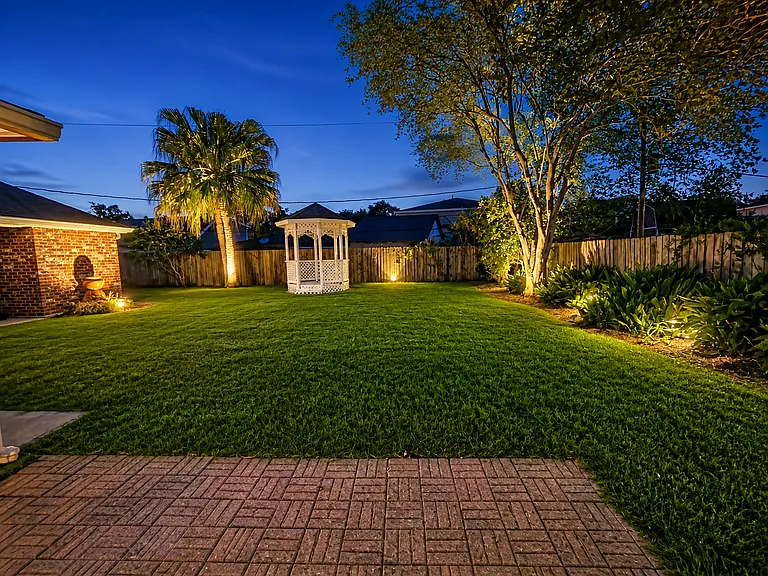 Backyard with landscape lighting
