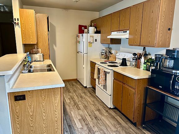 Kitchen open into the living room and dining area. The person stuck with the dishes even gets a view of Lake Michigan!