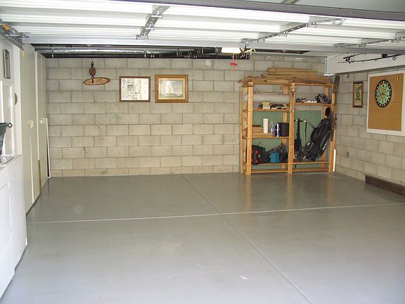 2 car garage with storage cabinets