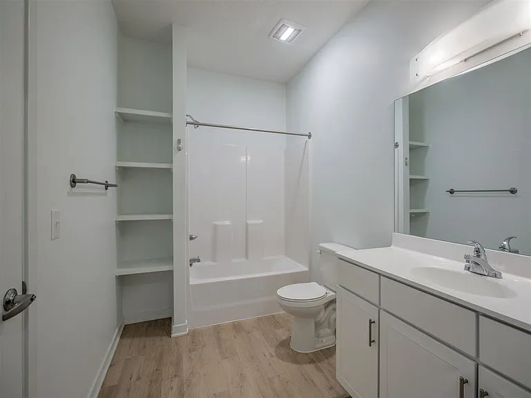 Large bathroom with shelving at The Rise.