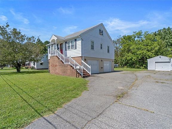 Large driveway will accommodate multiple guests and vehicles