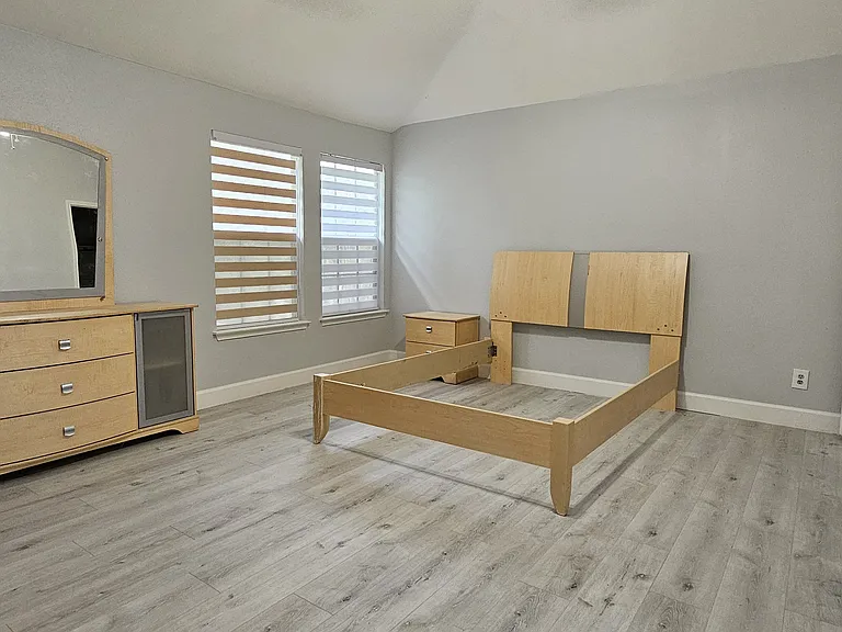 8.BedRm1-Spacious primary bedroom with smart ceiling fan and LED lighting