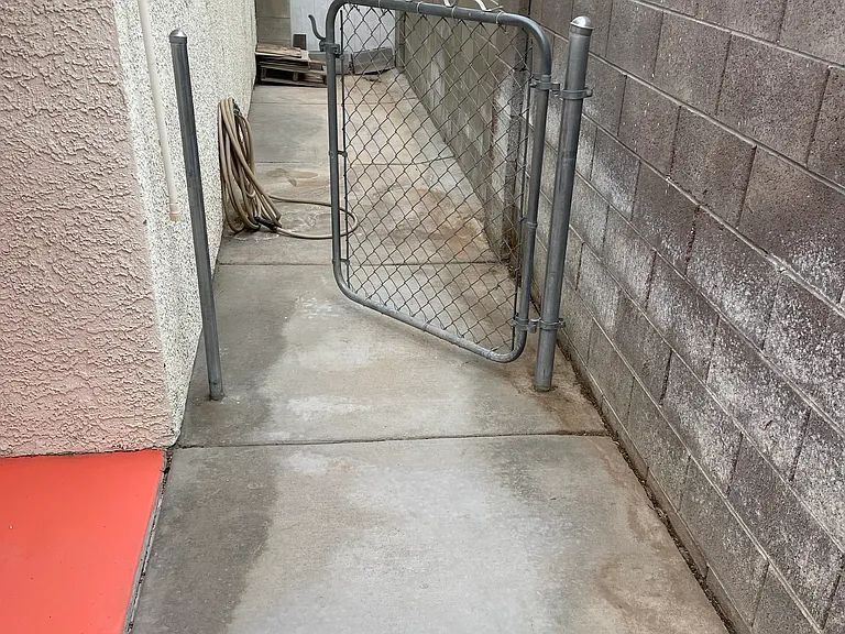 Right side yard. Private pet gate, in case you need to keep pet away from rest of backyard while visiting or eating.