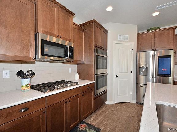 Double oven with upgraded stove top. (Note: Refrigerator will be replaced.) source: Pikes Peak Multiple Listing Service from prior sale of home