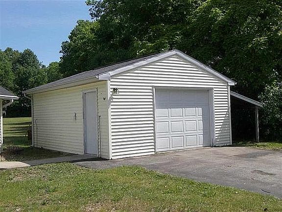 garage with lean to for boat