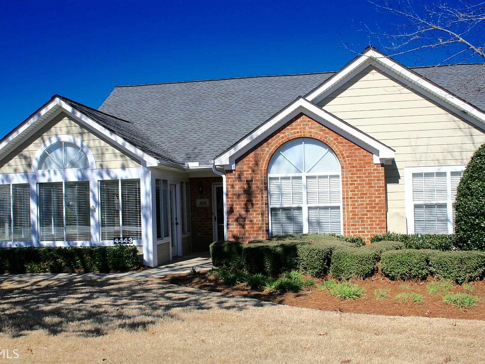 Beautiful front of home in active swim community.