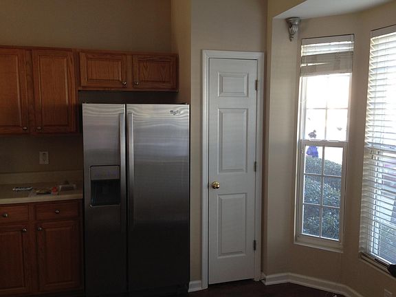 kitchen with bay window and stainless appliances