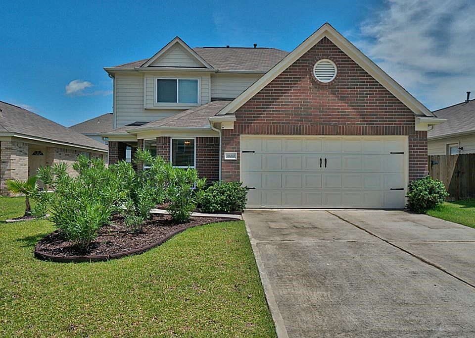 Welcome Home ! Added landscaping , flower bed paver s and barn door hardware on the garage door gives this 4/5/bedroom added curb appeal !