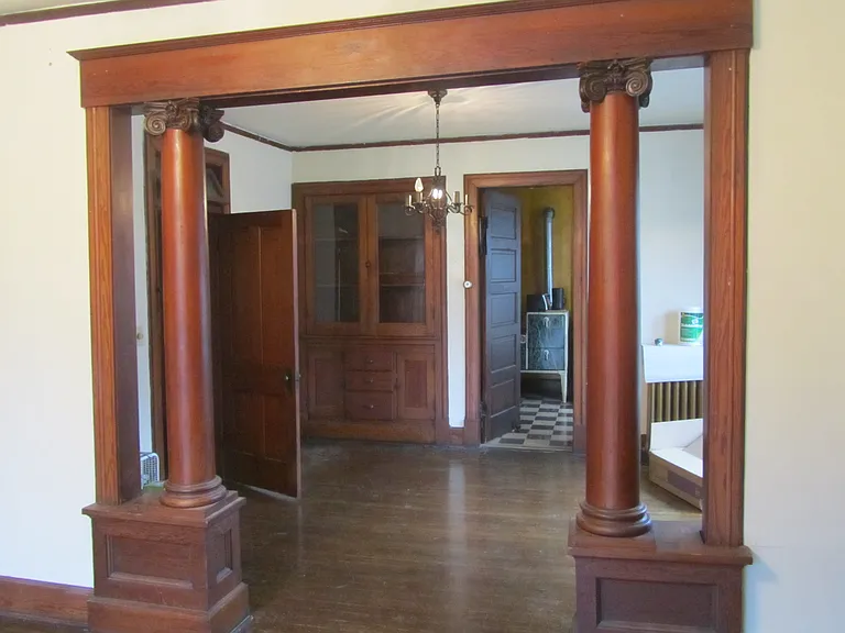 View from living room into dining room. The whole apartment has beautiful woodwork.