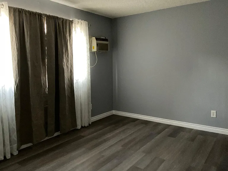 bedroom with window AC
