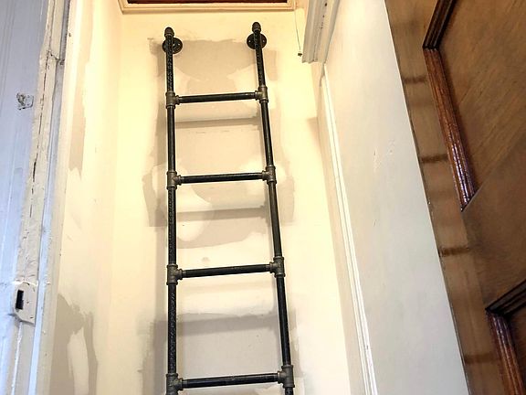 Crawl space under the roof access from 3rd bedroom with ladder