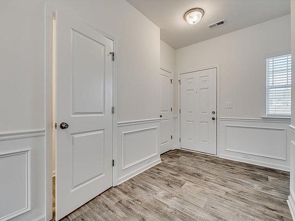 Entryway with Elegant Picture Frame Molding