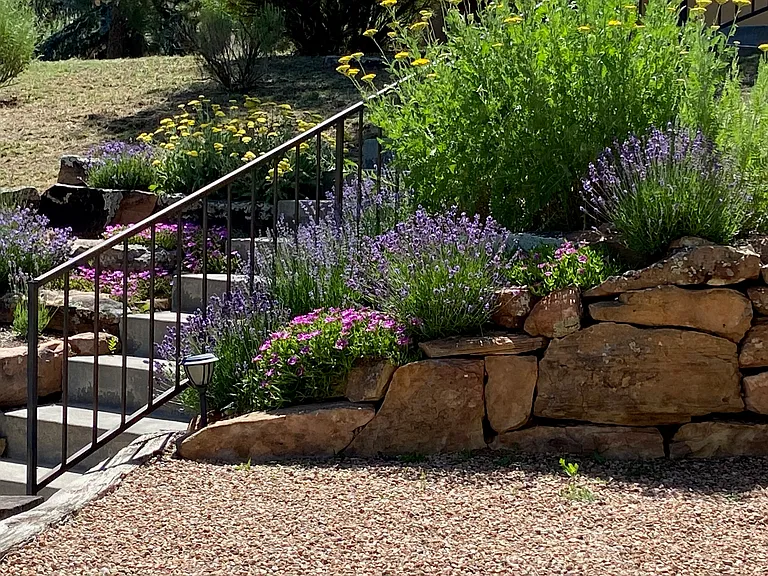 Step access from street ... rear access through patio/portal and garage is all on one level . . .